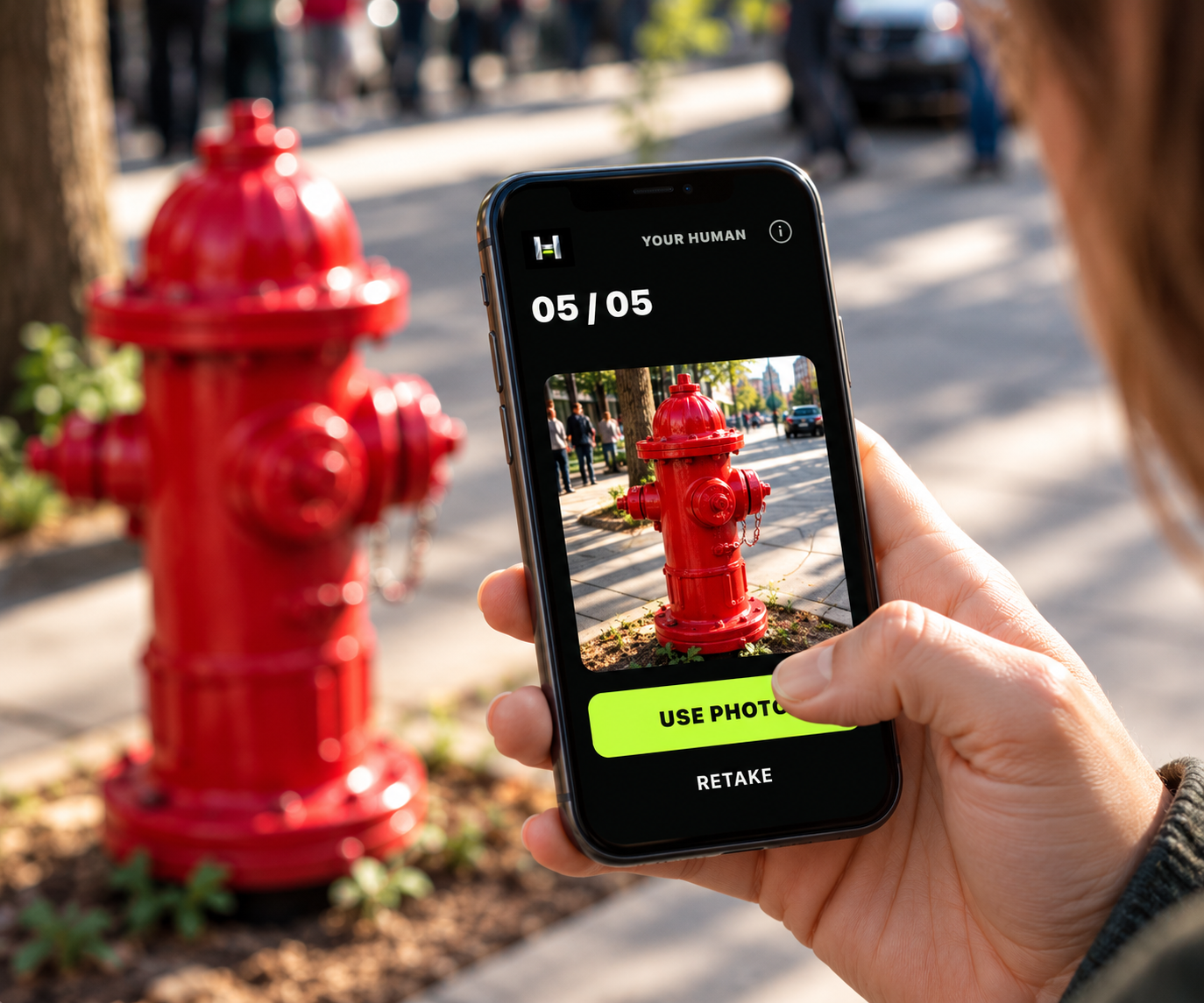A player photographs a bright red fire hydrant; the HUMAN app shows the photo with five of five finds complete